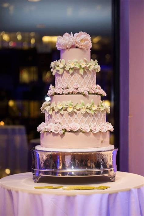 Flowers come in an amazing range of colors, both natural and tinted, so it won ' t be difficult to find blooms that perfectly match the rest of your wedding. Light pink wedding cake with delicate flower details ...