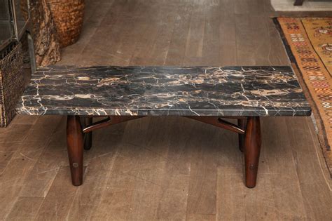 Available in beautiful fabrics and leathers, storage ottomans or benches help you neatly stash away blankets, remotes, and games, and keep surfaces clear of clutter. Low Marble Coffee Table at 1stdibs