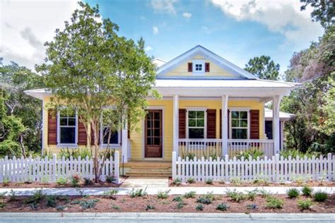 House exterior ideas and designs. 12 Charming Yellow Houses - Town & Country Living