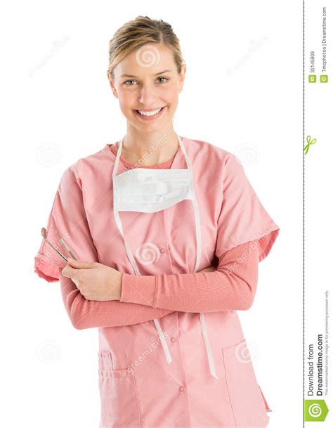 female dentist with mirror and probe standing arms crossed stock image image of beauty