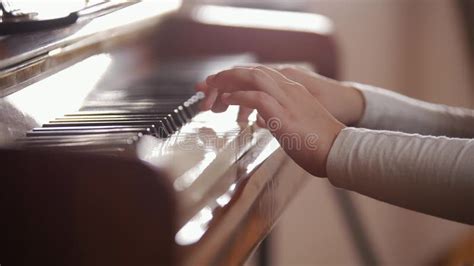 Child Playing Piano Side View Of A Child Playing Piano Stock Footage