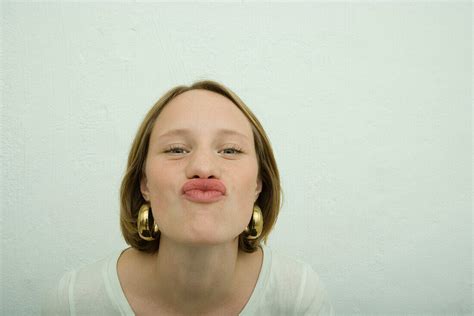 teen girl puckering lips portrait license image 70358605 lookphotos