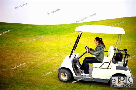 Young Woman Driving Golf Cart Car Stock Photo Picture And Low Budget