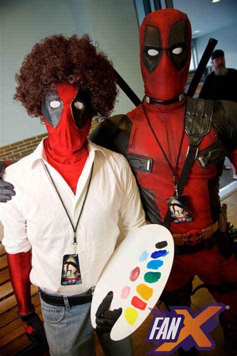 Two People Dressed Up As Deadpool And Spider Man Are Standing Next To
