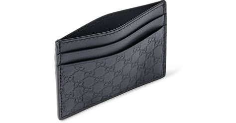 Mulberry's slim wallets and card holders are perfect for minimising your pocket space, or find classic leather styles by saint laurent and vivienne westwood. Gucci Embossed Leather Cardholder in Blue for Men - Lyst