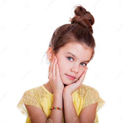Portrait Of A Charming Little Girl Smiling At Camera Stock Photo