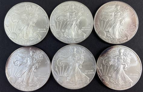 Lot 6 2010 And 12 Walking Liberty Silver Dollars