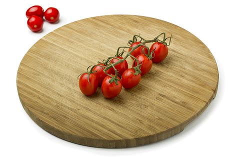 Tomatoes On Wooden Cutting Board Photograph By Francesco Rizzato Fine