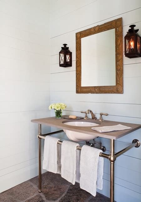 This modern bathroom features a timeless backdrop modernised by matt black taps, shower screen and radiator. New Home Interior Design: Modern Country Interiors