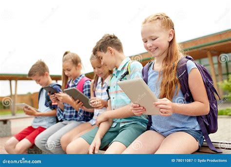 Group Of Happy Elementary School Students Talking Stock Image Image