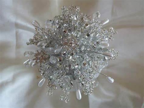 Finding the one—the perfect wedding dress—is where it all starts! Bridesmaids Bouquet, Winter Wedding, Snowflake Bouquet ...