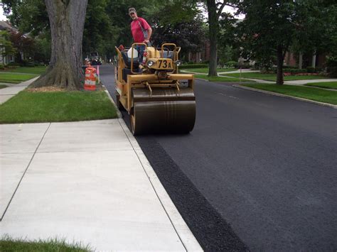 Asphalt Paving Driveway of a person's house breaks or ...