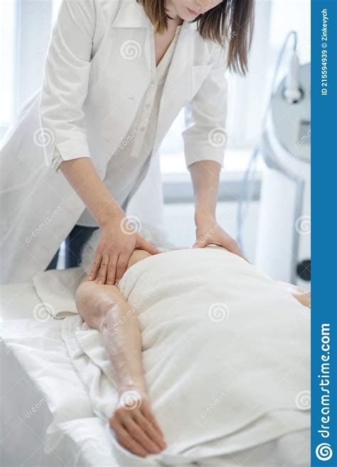 Female Massage Therapist Doing Back Massage Procedures To A Woman Stock Image Image Of