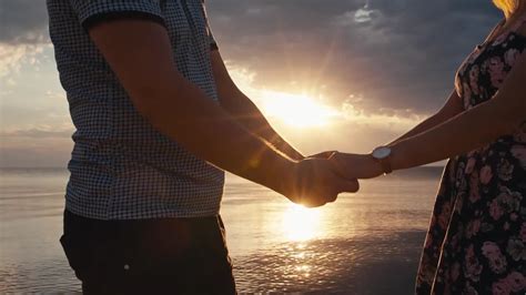 Holding Hands At Sunset Stock Video Motion Array