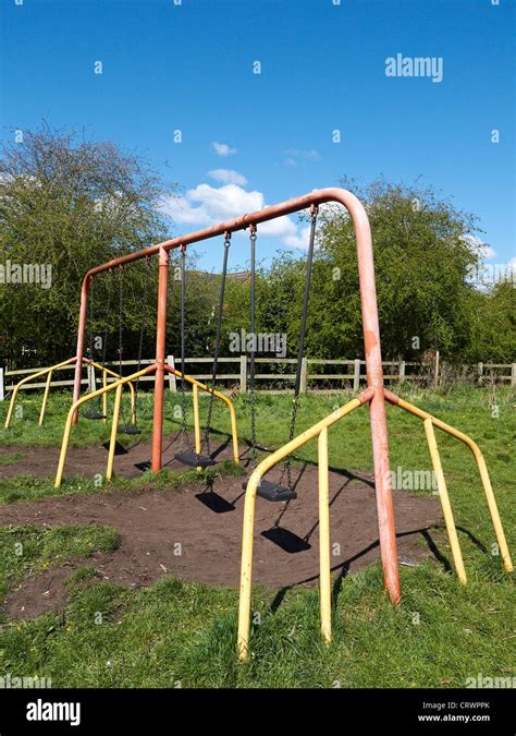 Swings In Playground Uk Stock Photo Alamy