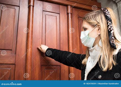 A Girl In An Antiviral Mask Knocks On The Doctorâ€ S Office Stock Image