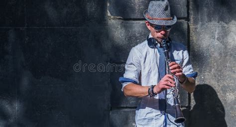 Musician Playing The Clarinet Outdoors Image With Copy Space For Text Or Design Stock Image