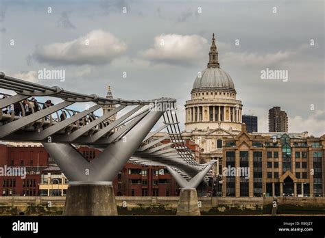 St Pauls Cathedral In London With Millennium Bridge As Foreground And