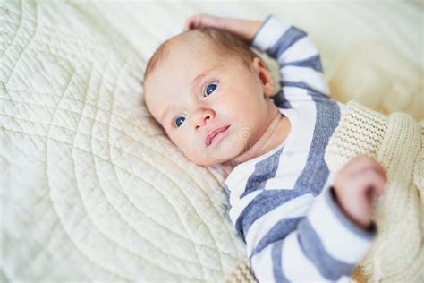 Baby Girl Lying On Bed In Nursery Stock Image Image Of Adorable Home