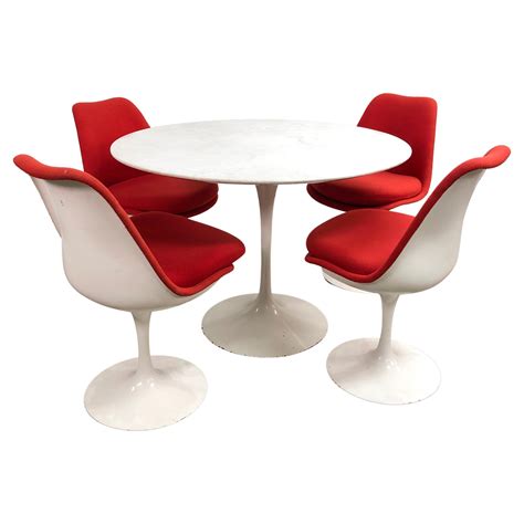 Mid Century Eero Saarinen Swivel Tulip Chairs And Early Cast Iron