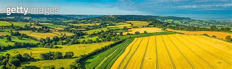 Aerial Panorama Over Picturesque Patchwork Landscape Green Fields Farm