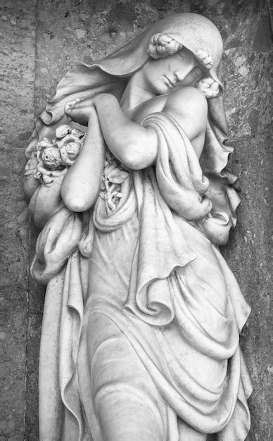 Premium Photo Stone Statue Of A Grieving Woman