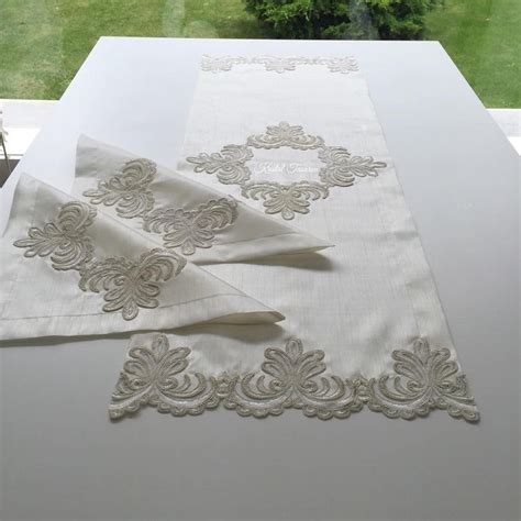 The Table Cloths Are Laid Out On Top Of Each Other