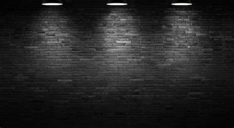 Premium Photo The Background Of The Black Brick Wall And The Light Of