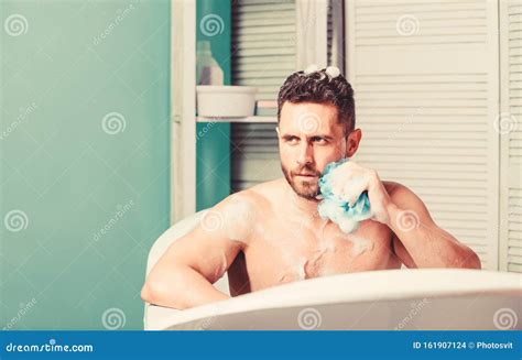 Man Handsome Muscular Guy Relaxing In Bath Spa Wellness Concept