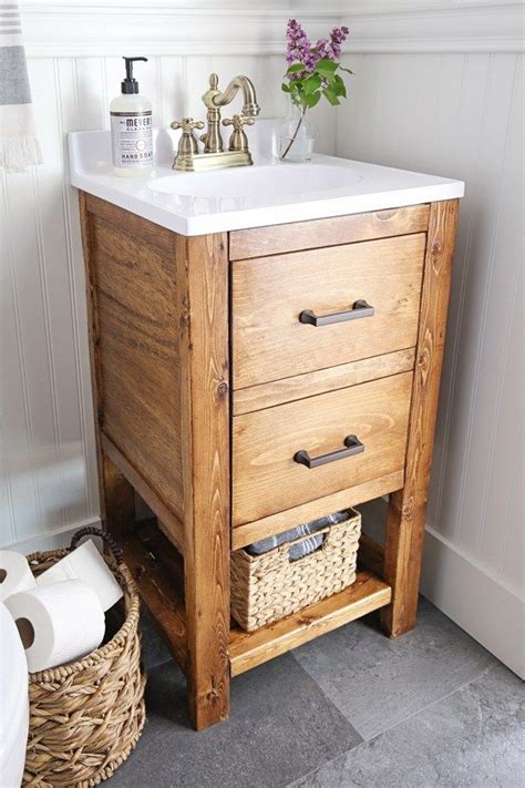 Recently renovated my bathroom and built a custom vanity to fit a 48in top i bought online.it has a large center drawer cut out around plumbing with shelf. DIY Bathroom Vanity for $65 | Diy rustic bathroom vanity ...