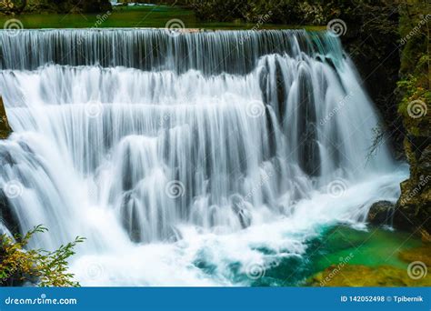 Autumn Forest Colors With Beautiful Turquoise Waterfall Outdoor In