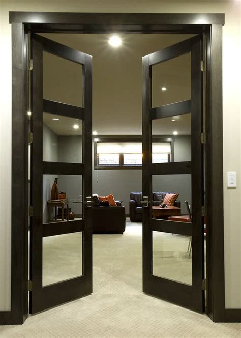 The crisp white living room is anchored by a sofa from jayson home and a papilio chair, creating an oasis of simplicity, ease, and eclecticism. Awesome Black Interior Doors Completing Elegant Room ...