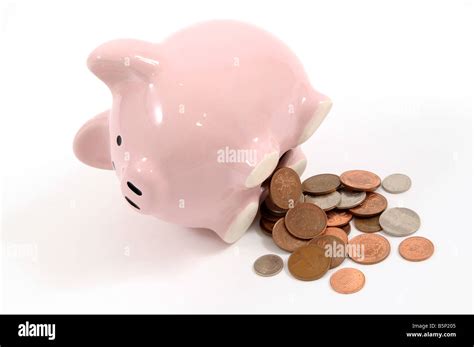 Piggy Bank With Money Coming Out Stock Photo Alamy