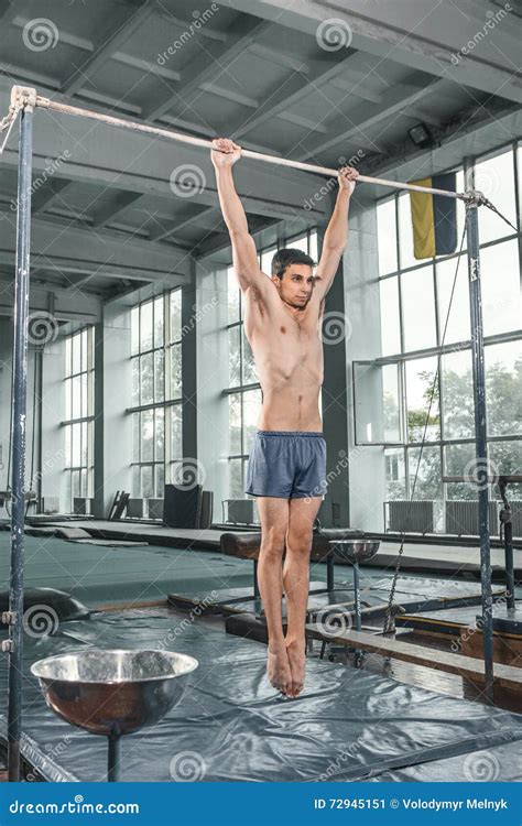 Male Gymnast Performing Handstand On Parallel Bars Stock Image Image