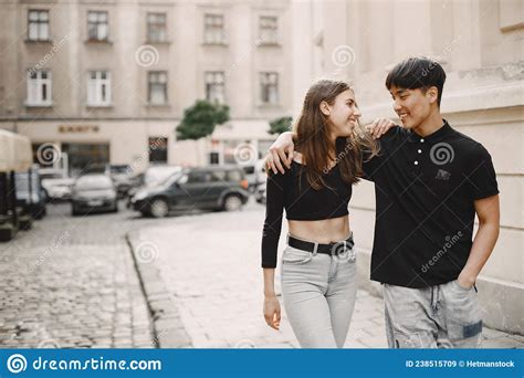 Two Lovers Hug On The Streets Of The Old City During A Date Stock Image