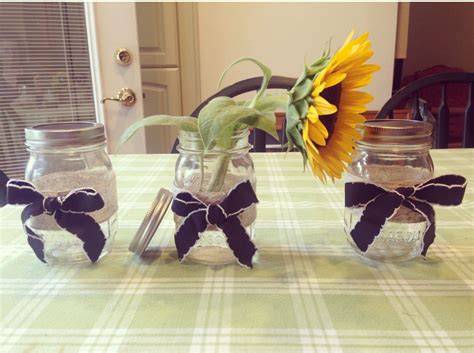 Put those mason jars to good use and use them to decorate as well with these distressed mason jar canisters. Just decorated some mason jars with ribbons I thought made a good combination. Jute ribbon with ...