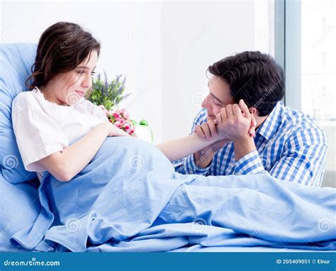 Caring Loving Husband Visiting Pregnant Wife In Hospital Stock Image