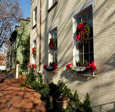 Old Brick Colonial House Decorated For Christmas With Wreath