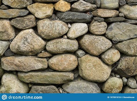 Rock Wall Of Natural Rounded River Stones Stock Photo Image Of Grey