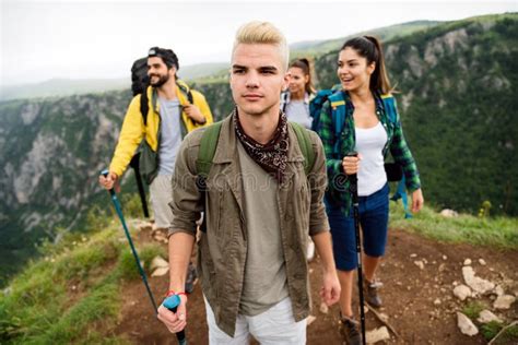 Group Of Happy Fit Friends Hiking Trekking Together Outdoor Nature