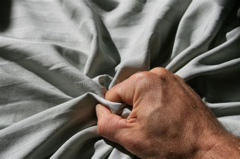 Grabbing Bed Sheet Man S Hand Grabbing A Crumpled Striped Bed Sheet Ad Sheet Man
