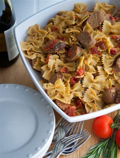 Farfalle Pasta Combined With Sliced Italian Sausage And Vegetables Like Sun Dried Tomatoes And