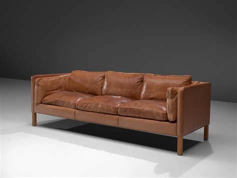 Cognac leather sofa (142 results) price ($) any price under $250 $250 to $750 $750 to $1,500 over $1,500 custom. Danish Three-Seat Sofa in Cognac Leather and Oak at 1stdibs