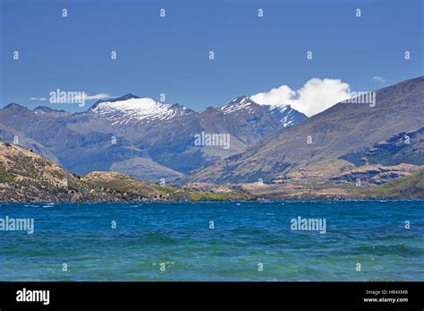 Lake Wanaka And View To Mount Aspiring Snow Covered Mountains Stock