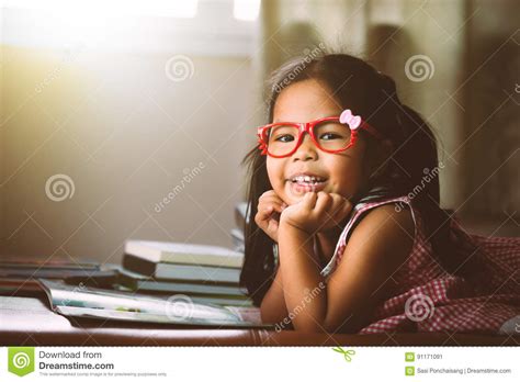 Cute Asian Little Put On Eyeglasses Reading A Book Stock Image Image