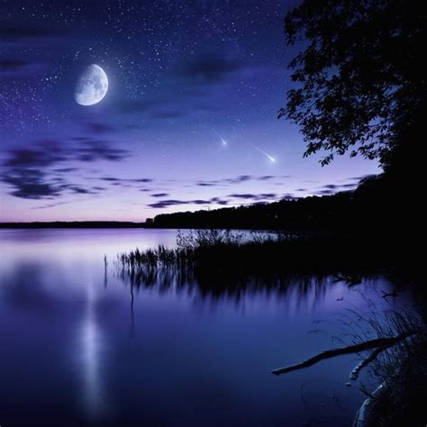 Tranquil Lake Against Starry Sky Moon And Falling Meteorites Russia