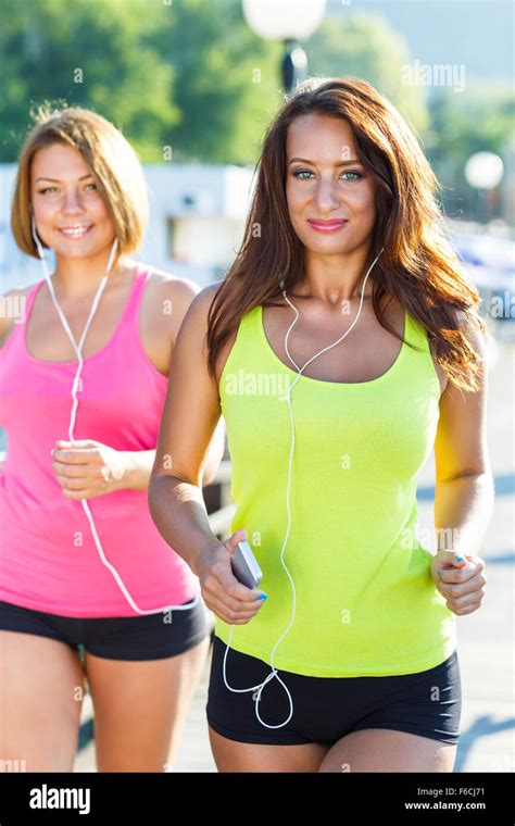 Two Cute Young Girls Jogging Outdoors Stock Photo Alamy