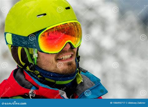 Portrait Young Man Ski Goggles Holding Ski In The Mountains Stock Image