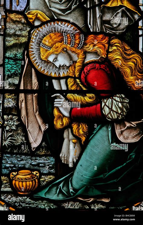 Stained Glass Window Depicting Mary Magdalene Kneeling At The Foot Of
