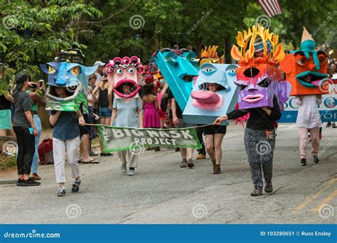 People Walk In Parade Wearing Huge Creative Masks On Heads Editorial